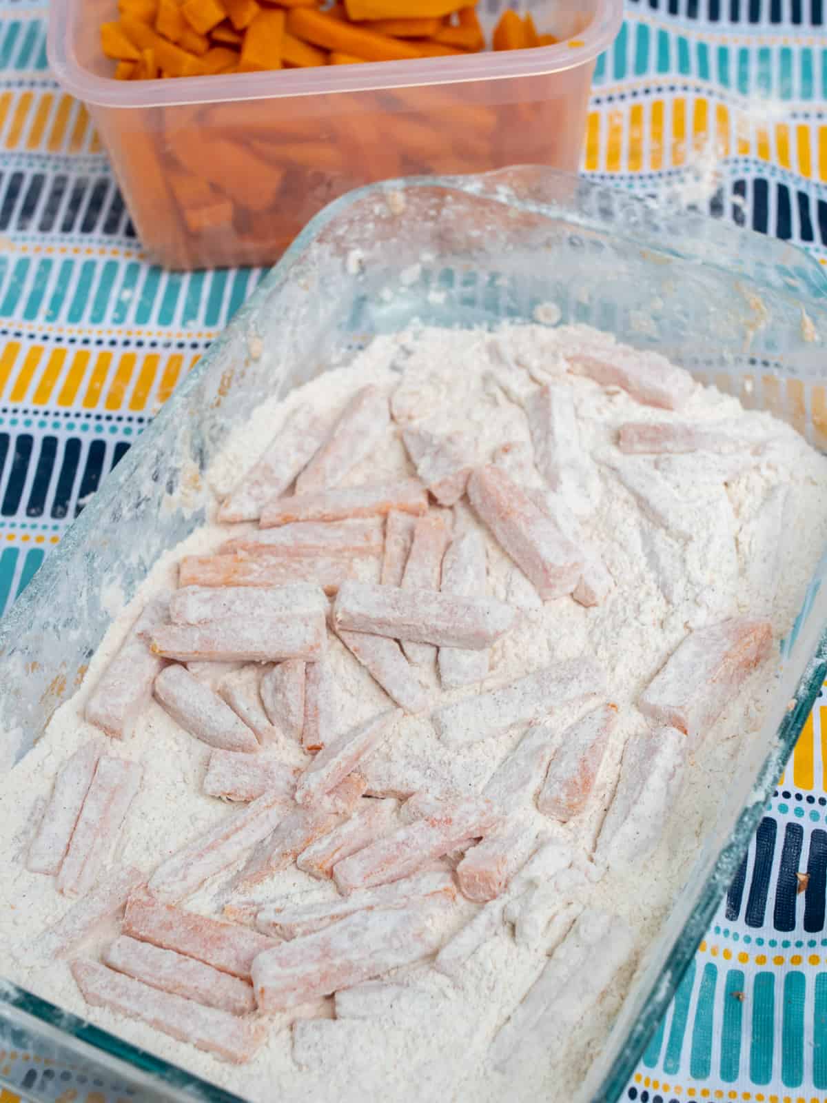 Blanched fries tossed in a seasoned flour mixture.