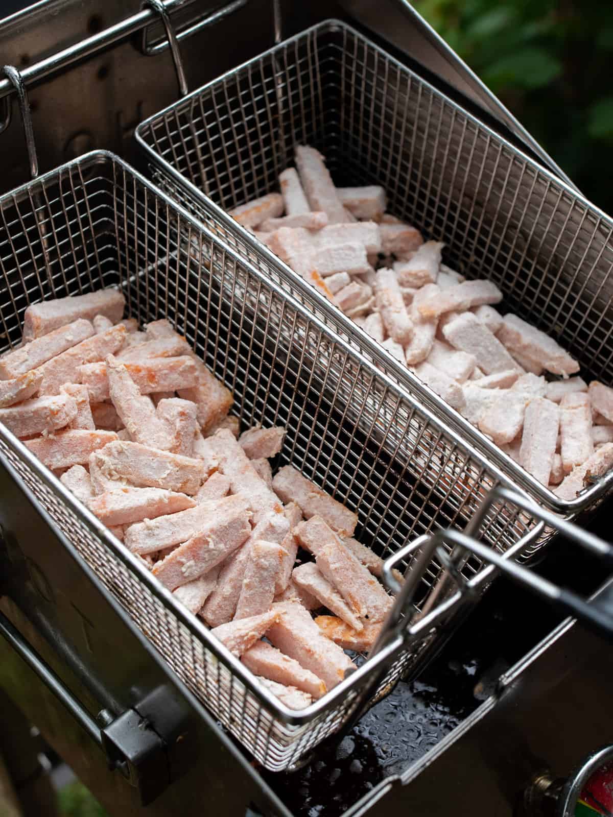 Full fry baskets ready to go into the hot oil.