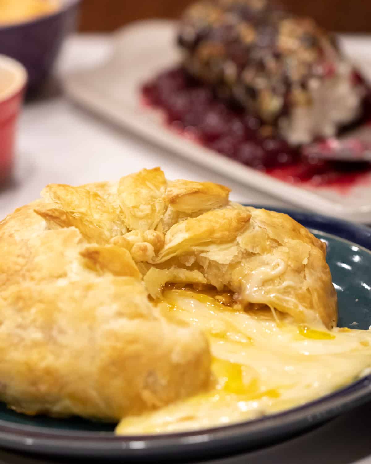 Melted cheese pouring out of puff pastry.