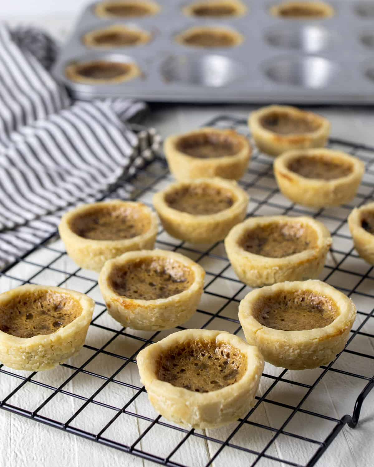 Tarts on a cooling rack.