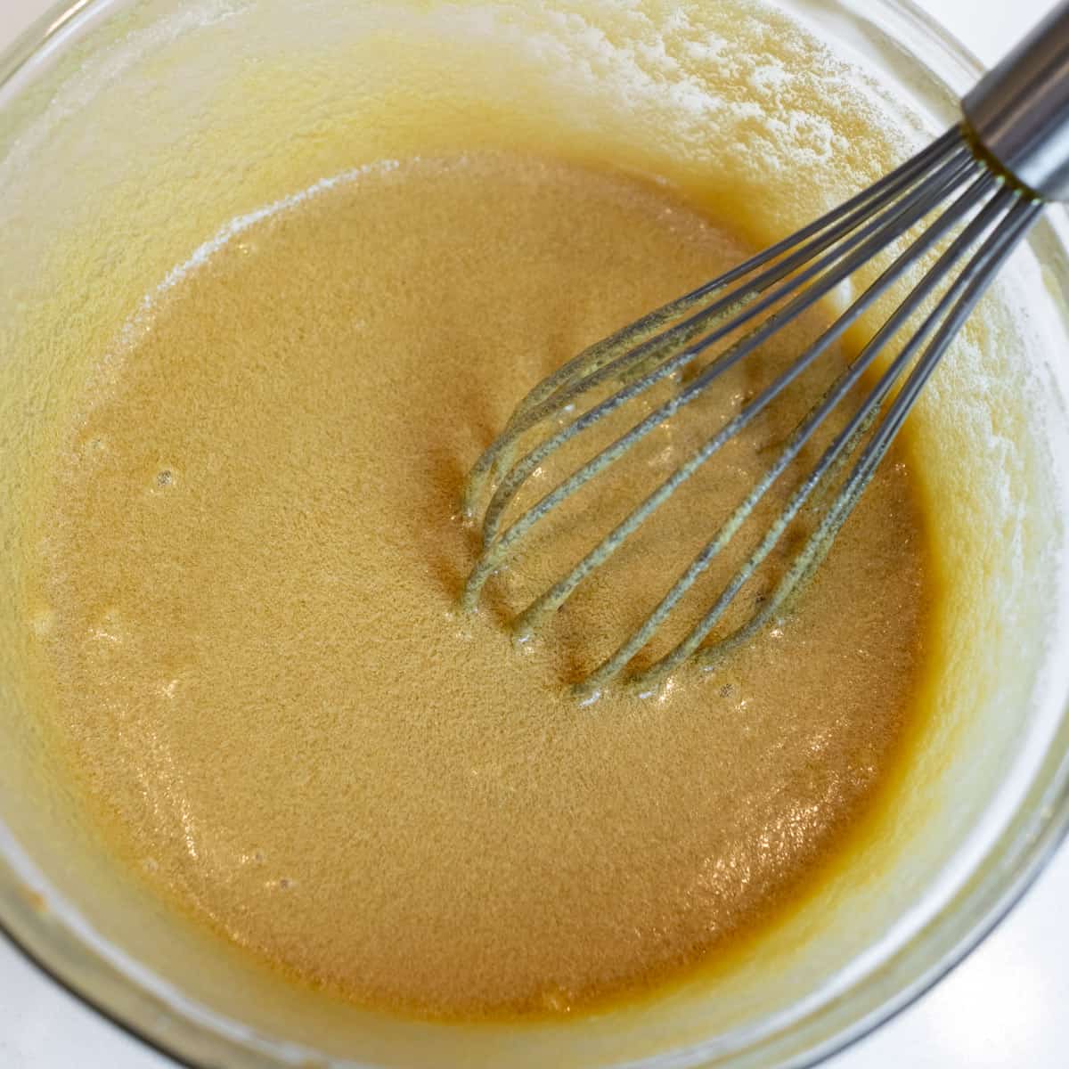 Tart filling mixture in a glass bowl.