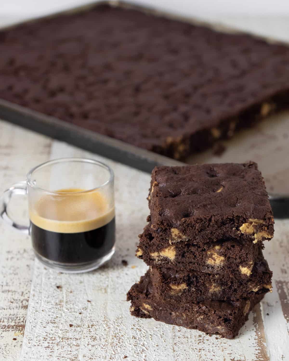 Chocolate cookies next to a cup of espresso.