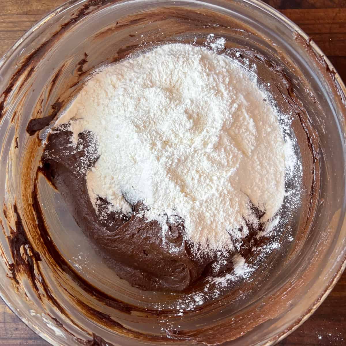 Chocolate batter with flour in a bowl.