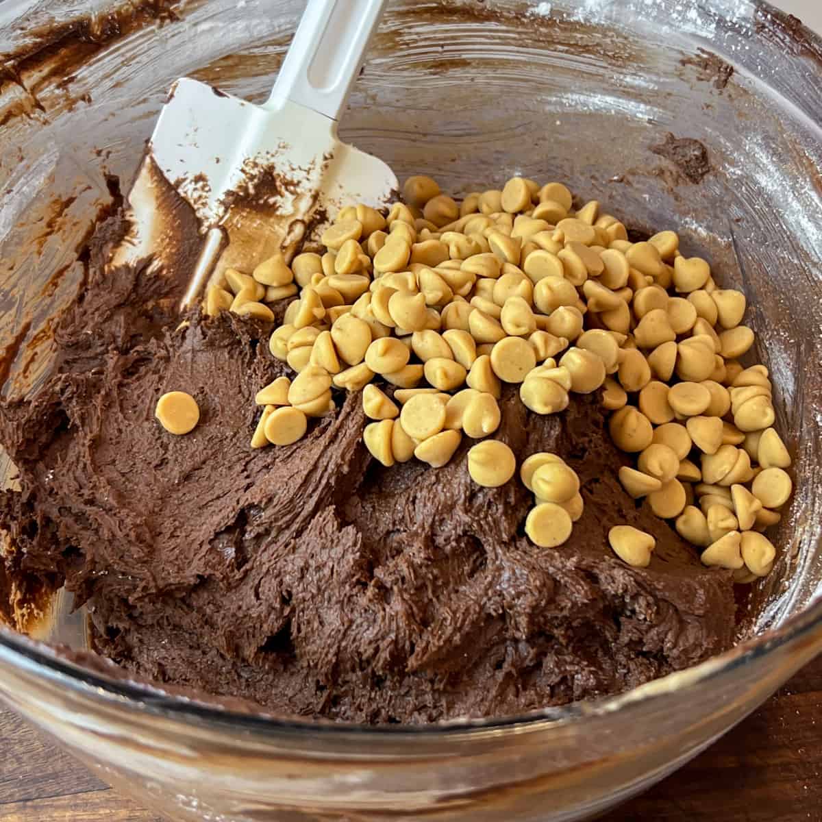Cookie dough with peanut butter chips on top.
