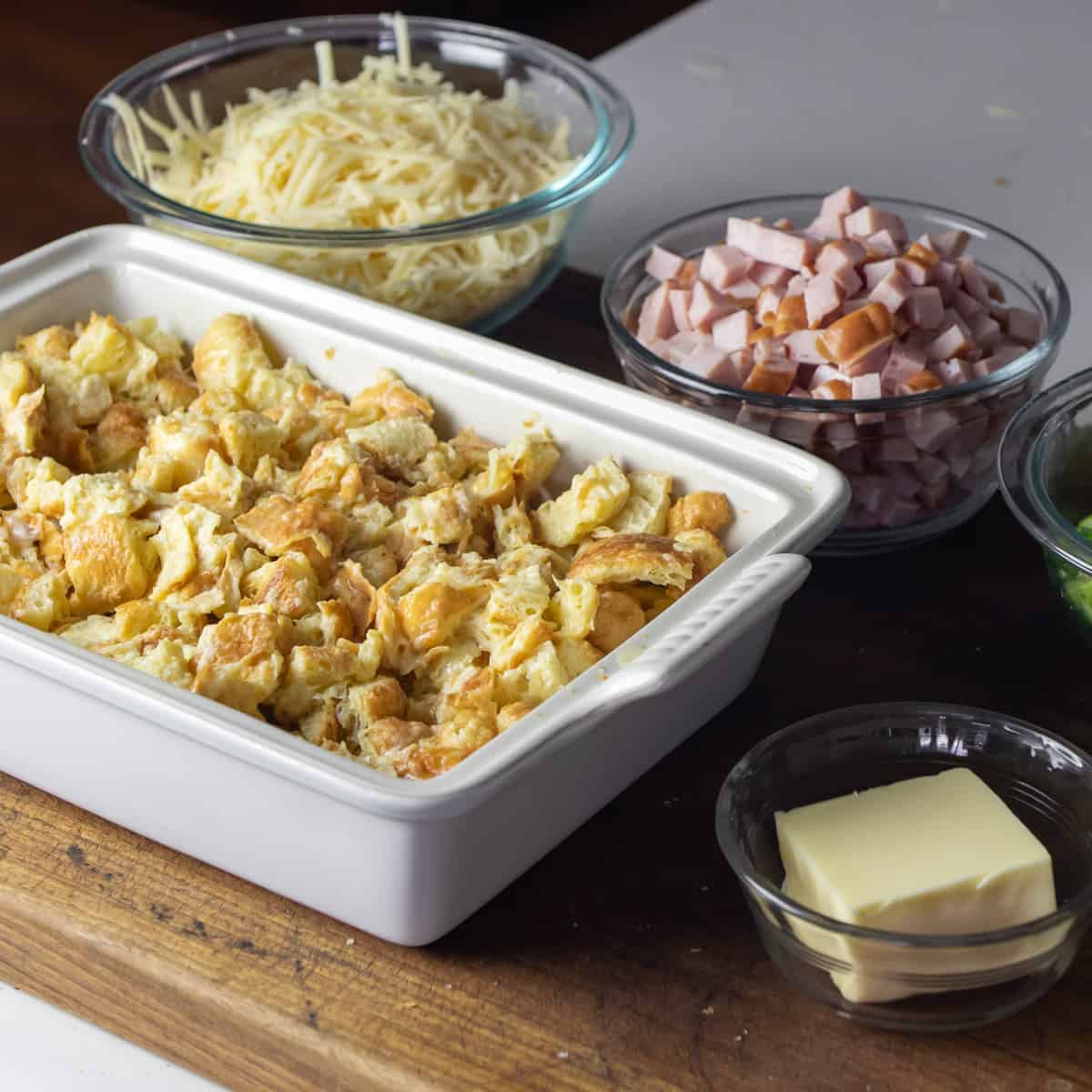 Croissant chopped up in a baking dish.