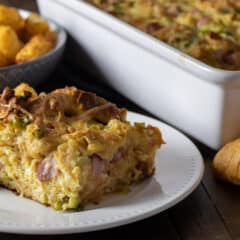 A piece of a breakfast casserole on a plate.