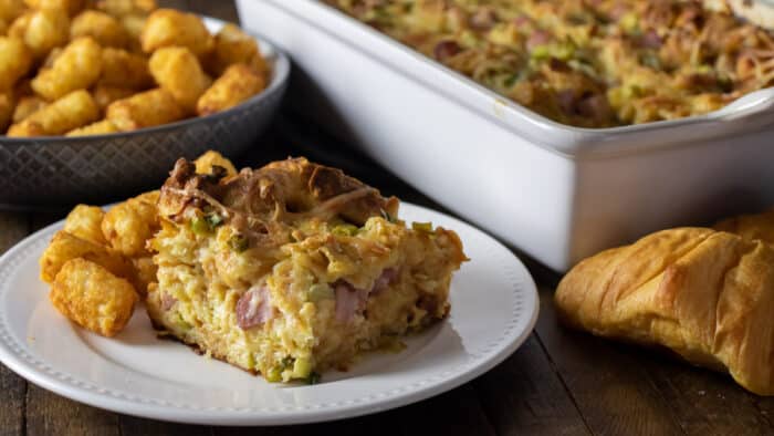 A piece of a breakfast casserole on a plate.