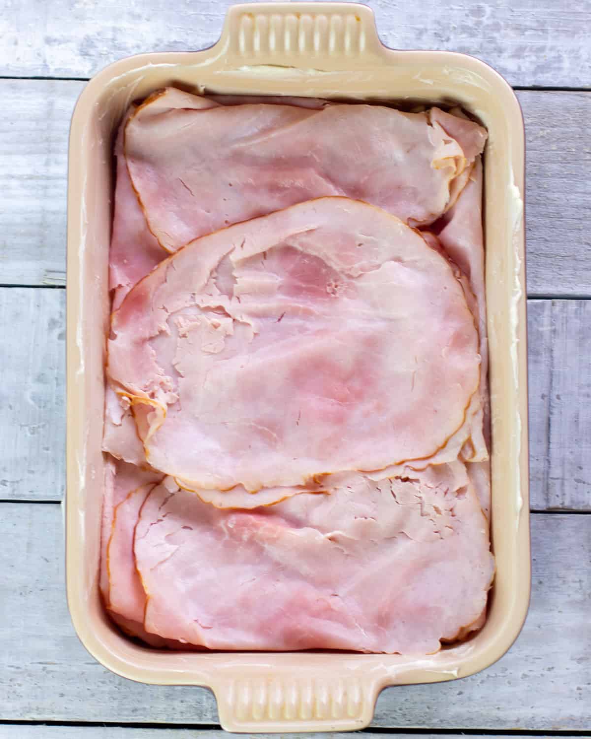 Ham lunchmeat in a baking dish.