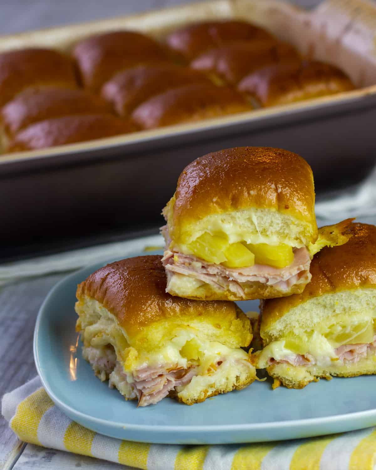 Ham with pineapple sandwiches in small buns.