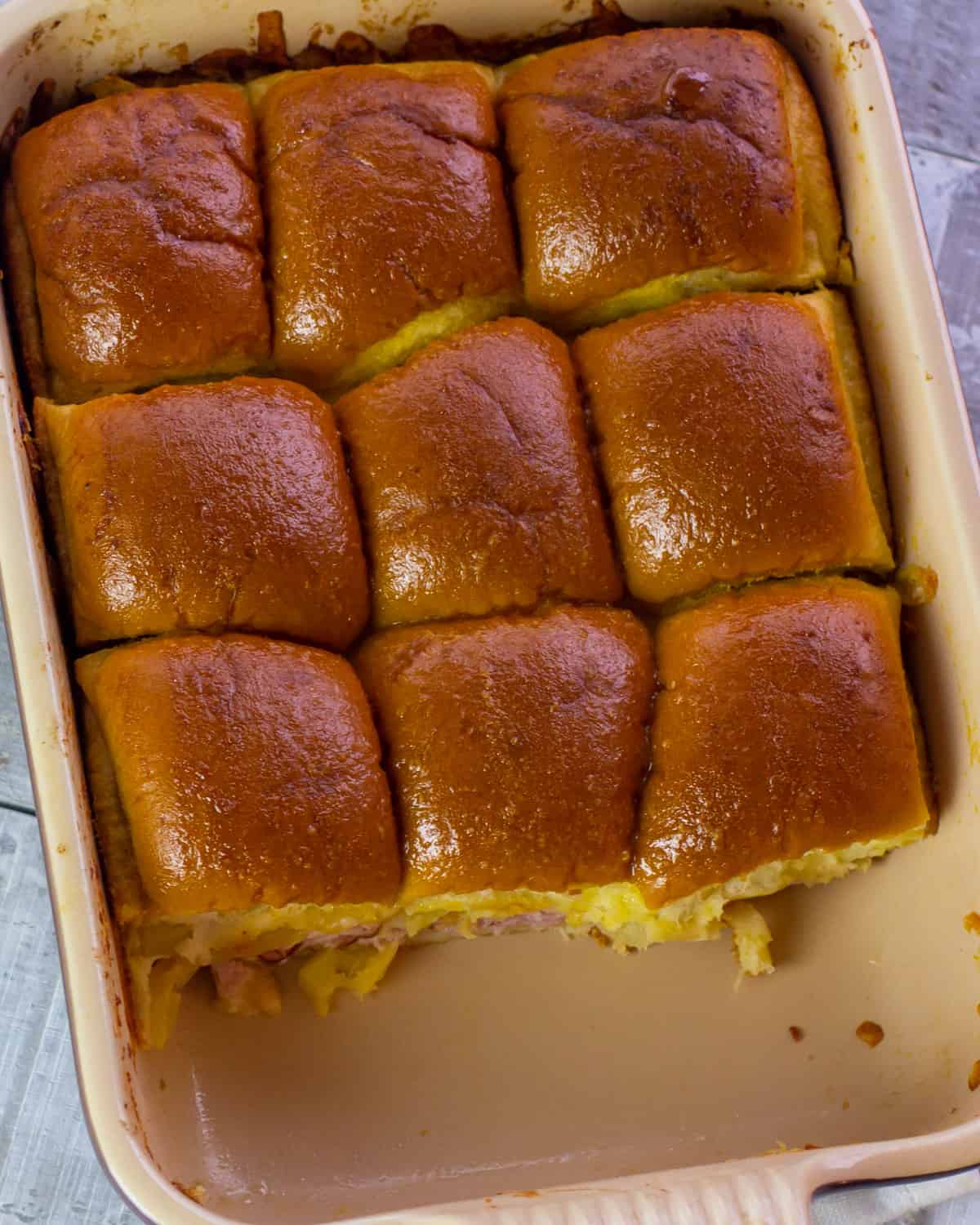 A baking dish with sliders.