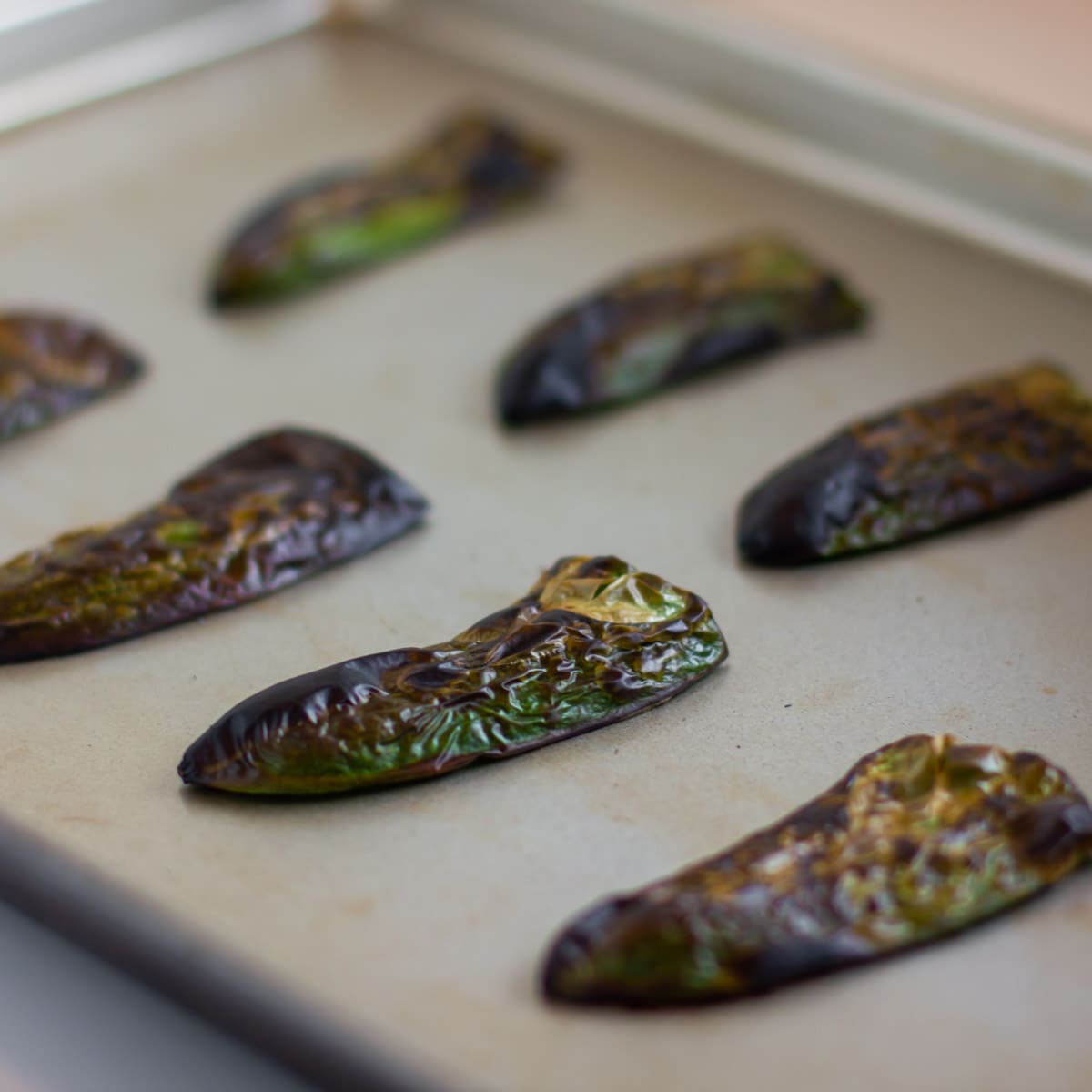 Baking sheet of roasted peppers on a baking sheet.