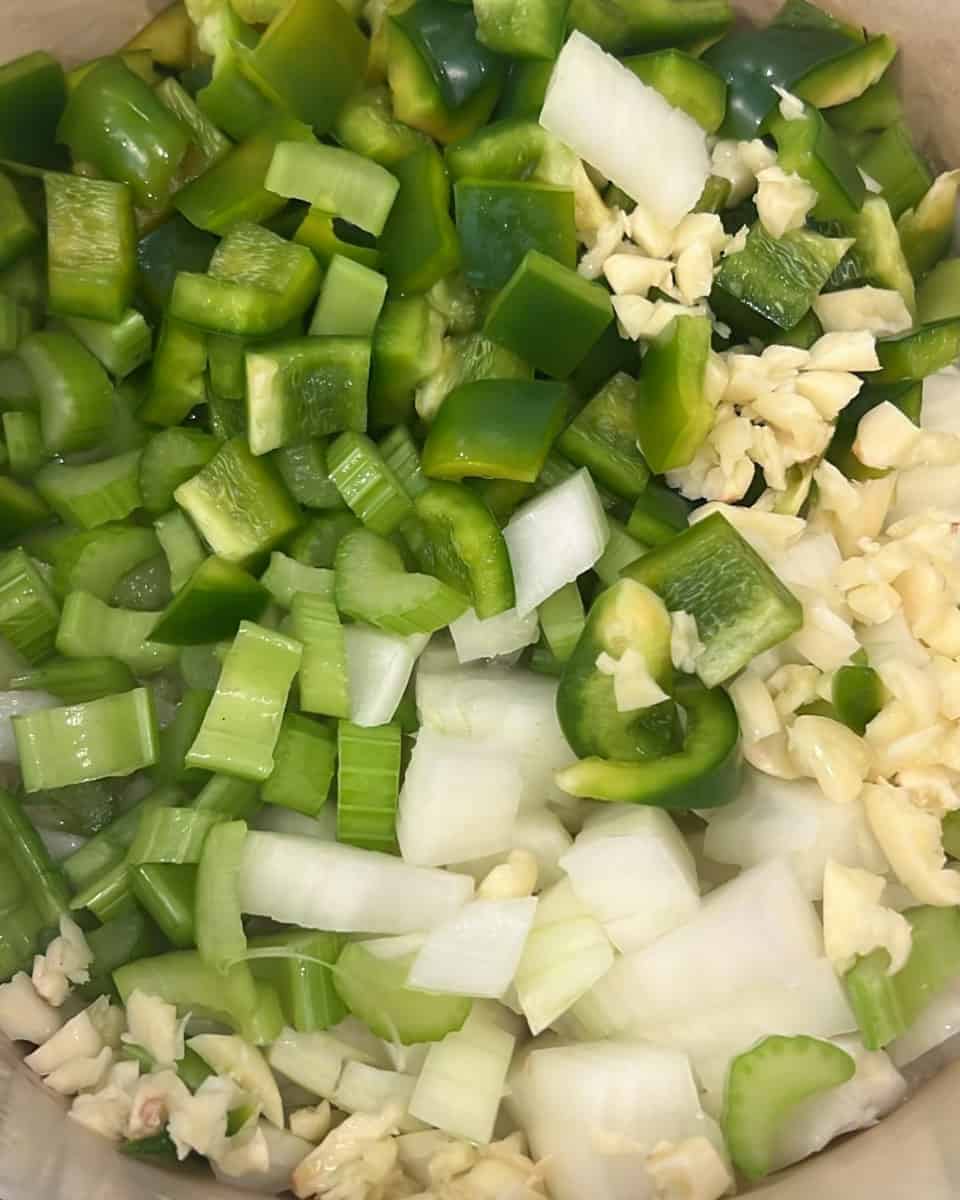 Vegetables sautéing in a dutch oven.