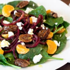 Overhead picture of salad on a white plate.