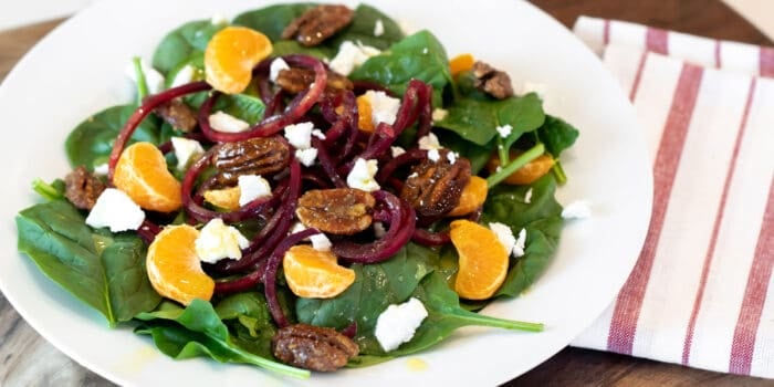 Overhead picture of salad on a white plate.