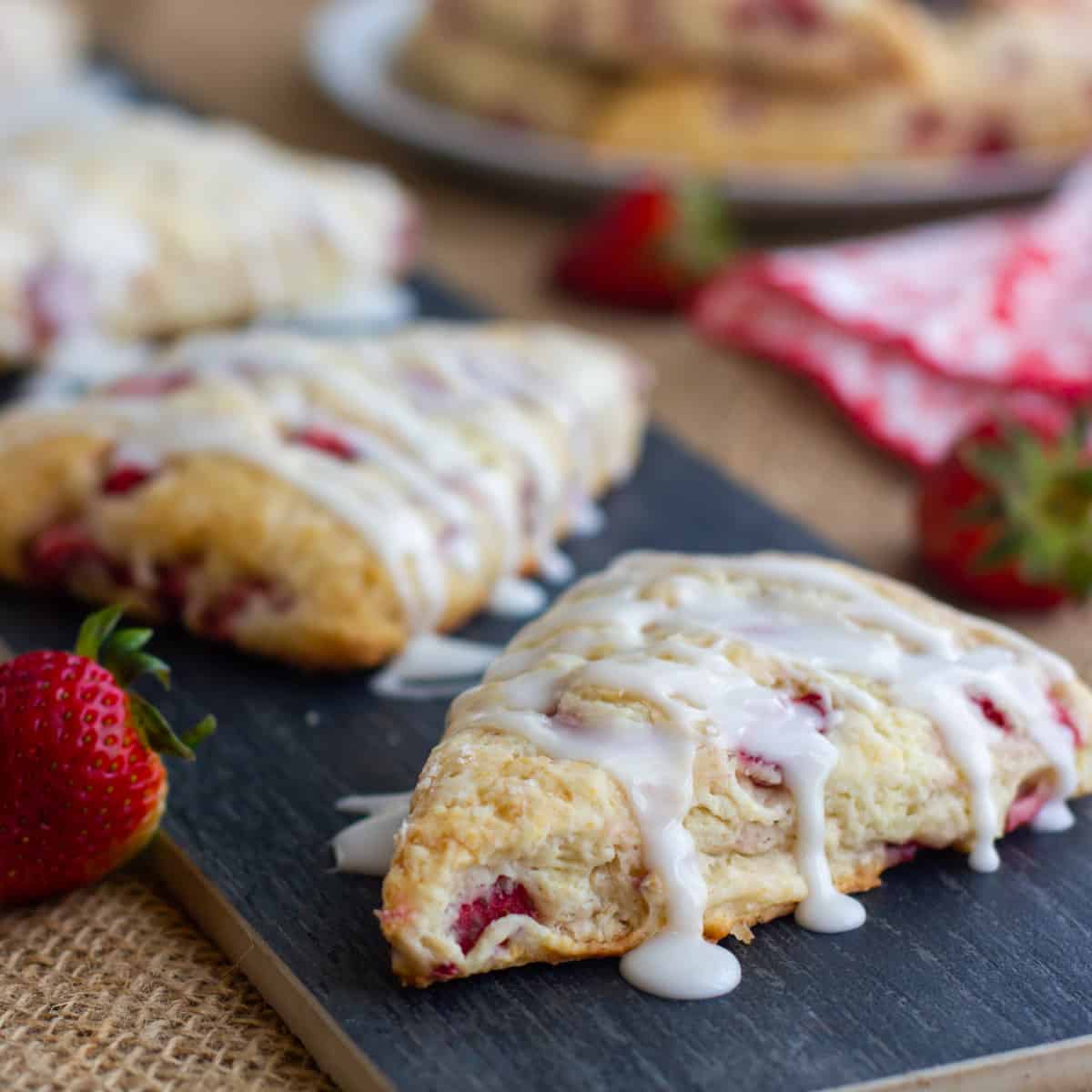 Close up picture of scones with icing drizzle.