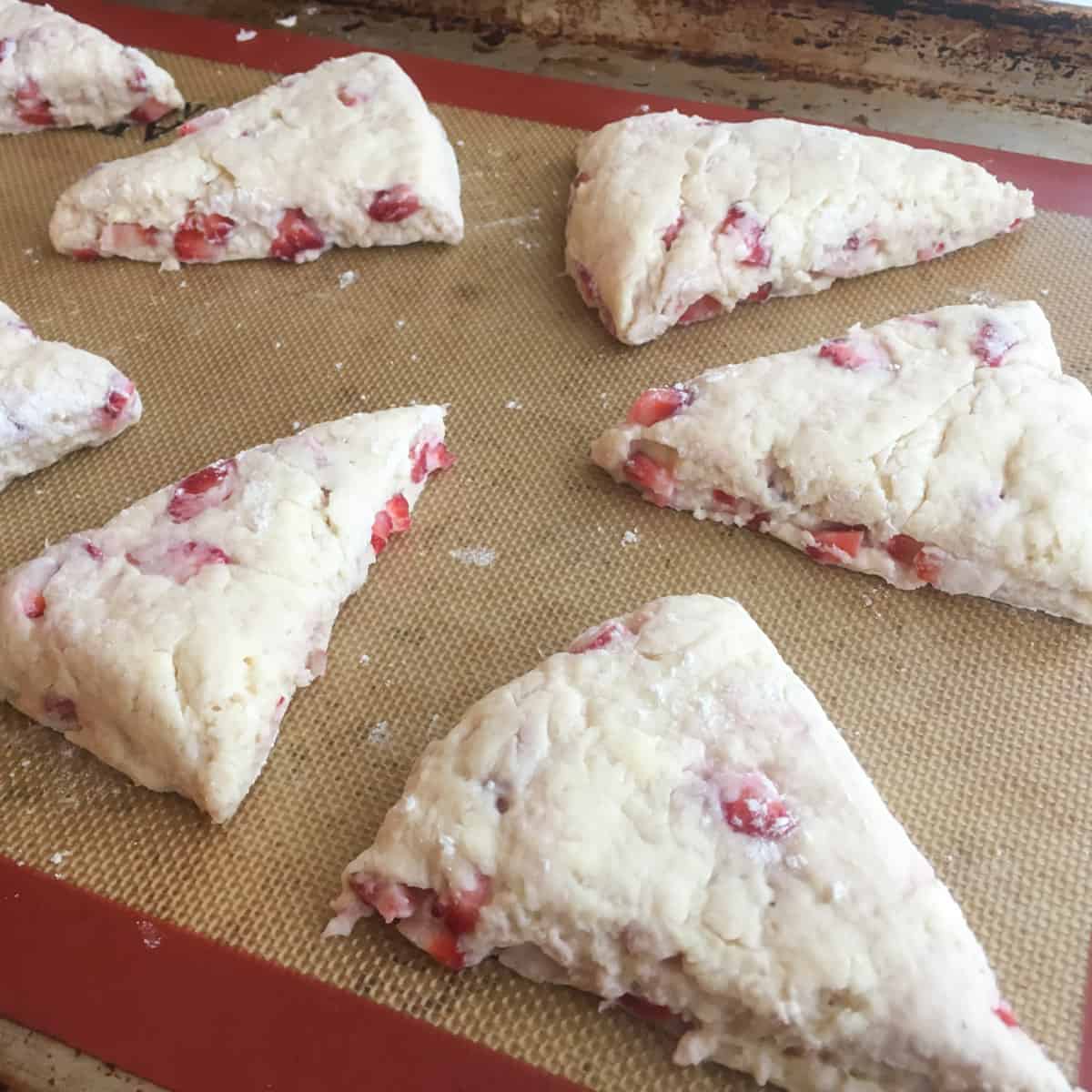 Raw dough shaped and placed on a baking sheet.