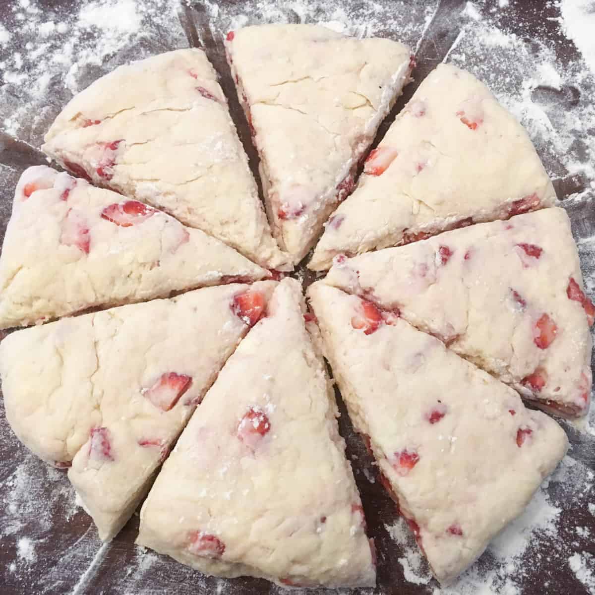 Scone dough in a shaped circle and cut into wedges.