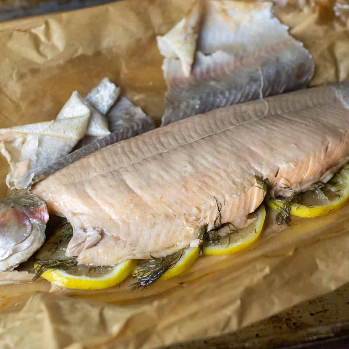 A baked fish with skin pulled back.