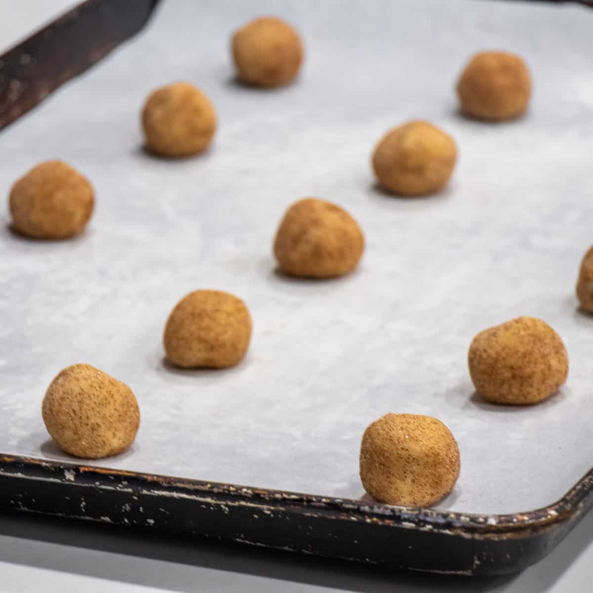 Raw cookies on a baking sheet.