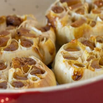 Close up picture of garlic in a baking dish.