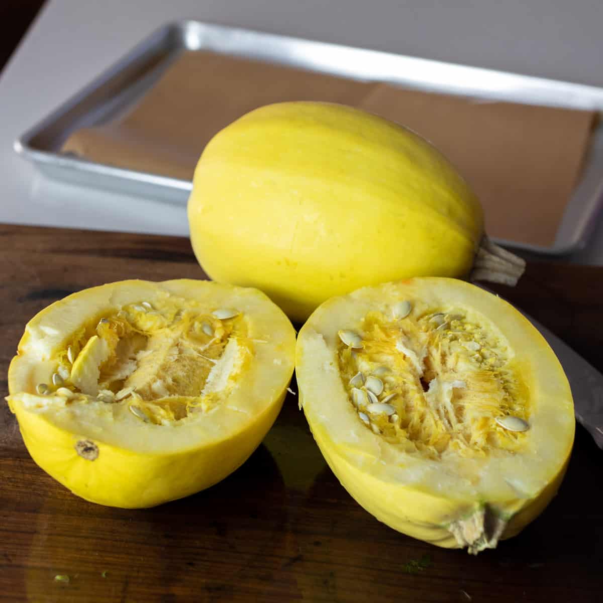 Yellow round squash cut in half lengthwise.