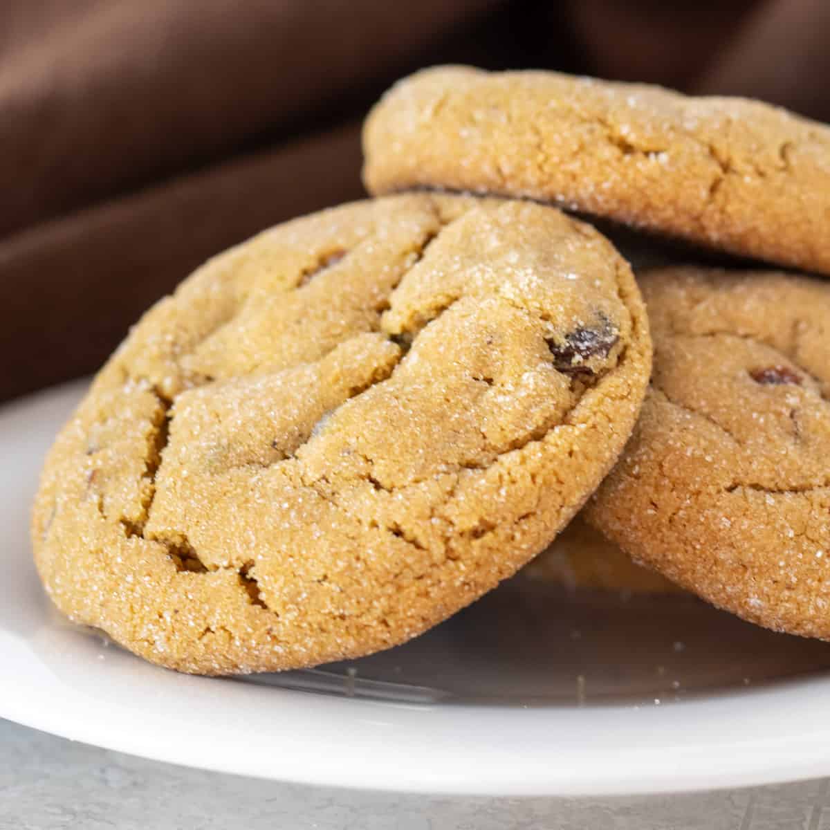 A plate with raisin cookies.