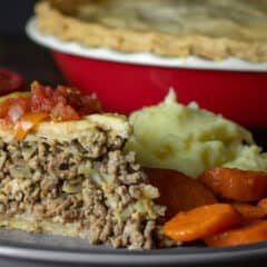 Close up picture of a slice of beef pie