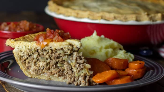 Close up picture of a slice of beef pie