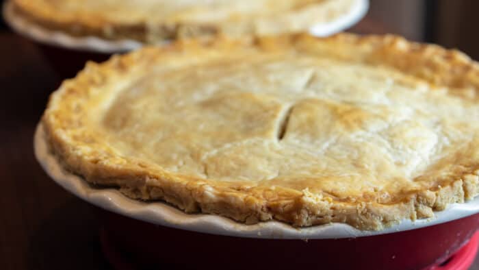 Two fresh baked pies with flaky crust.