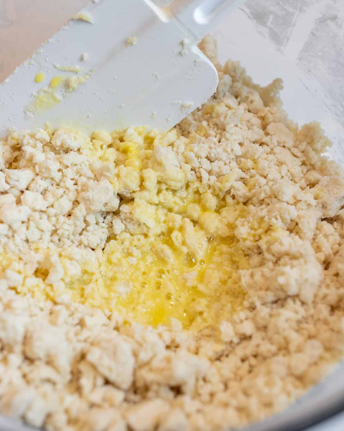 Raw scrambled egg poured into pie dough.