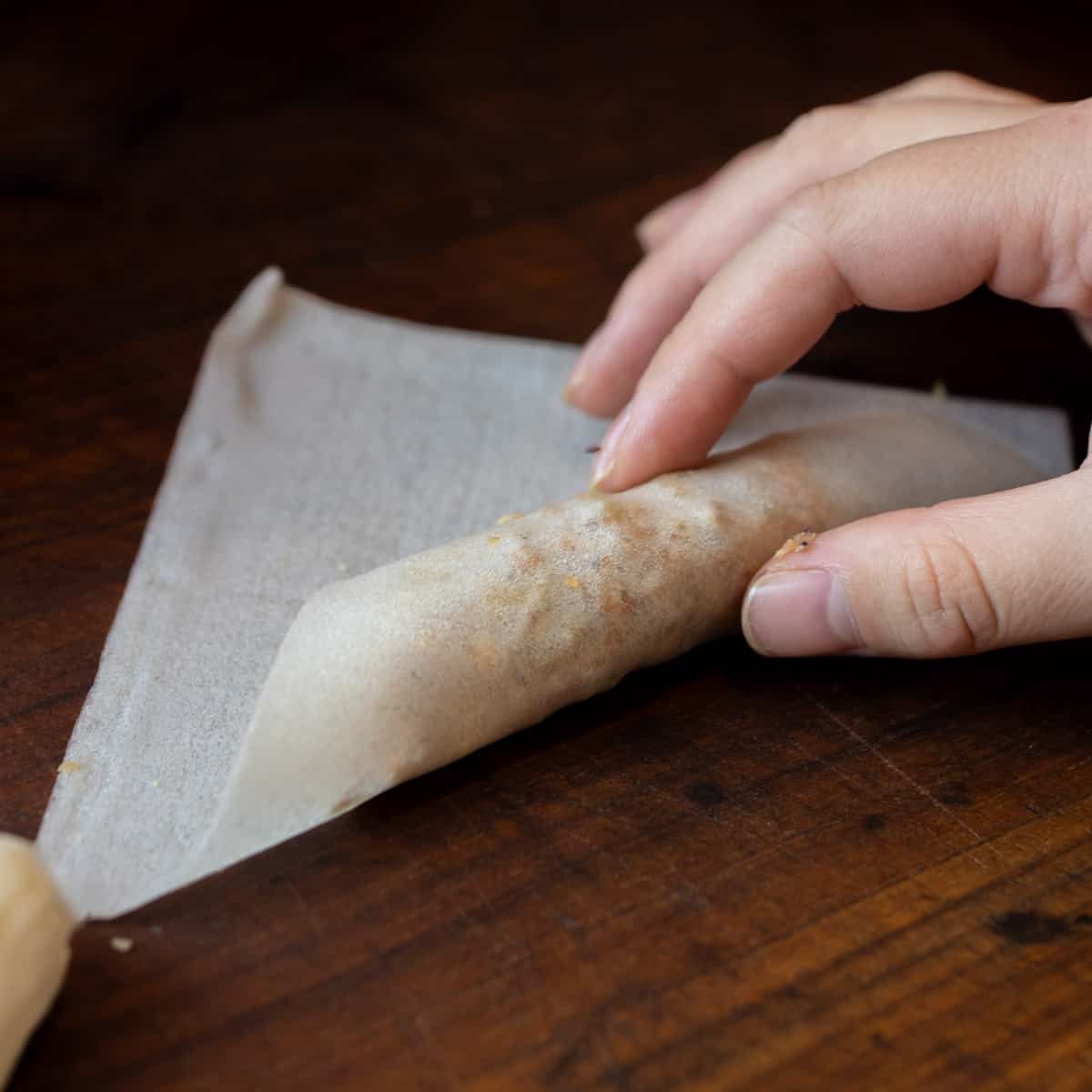A lumpia in the process of being rolled.
