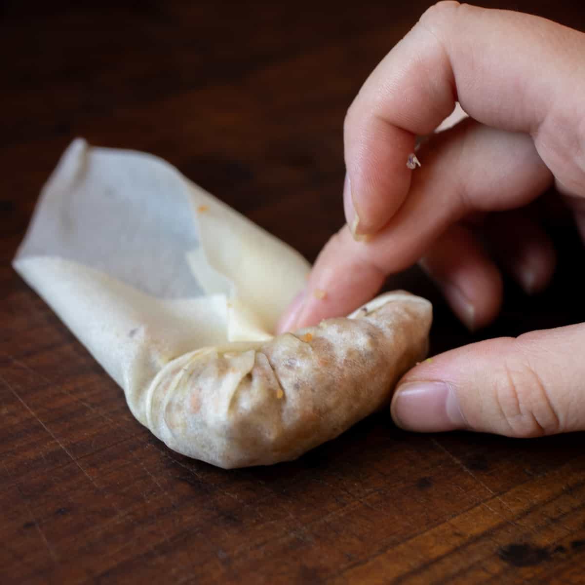 A spring roll being assembled.