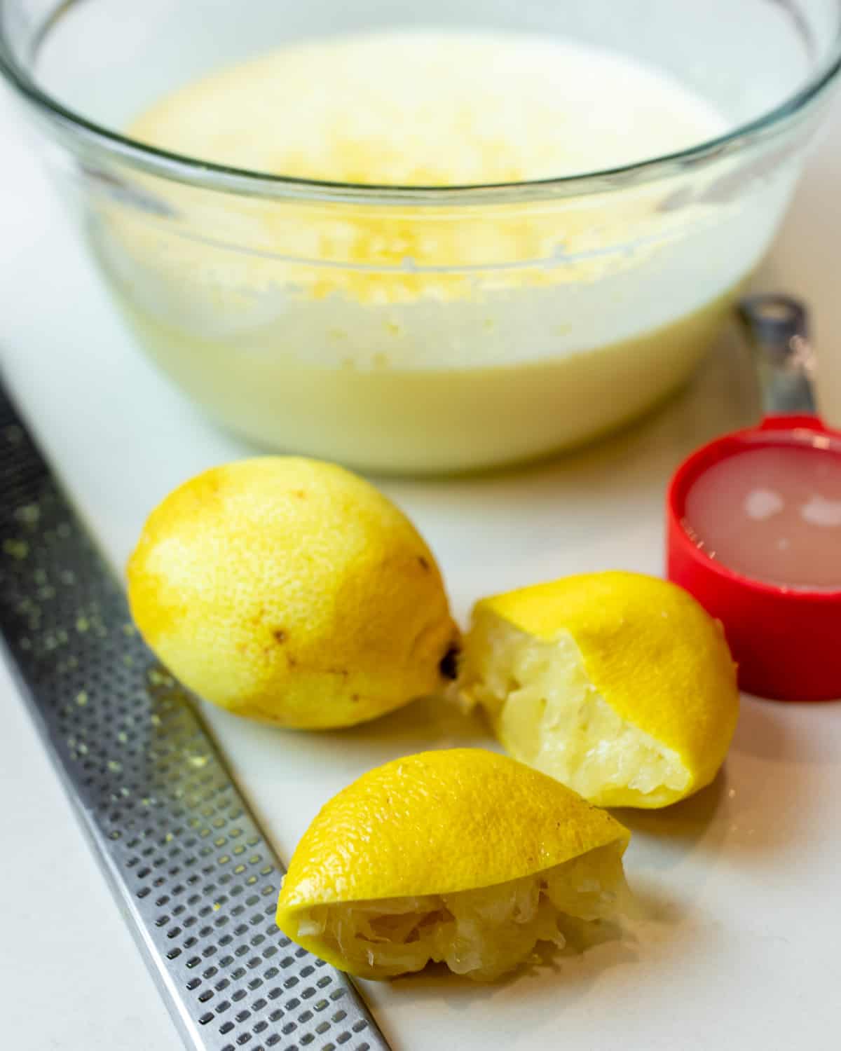 Lemons that have been zested and squeezed of juice.