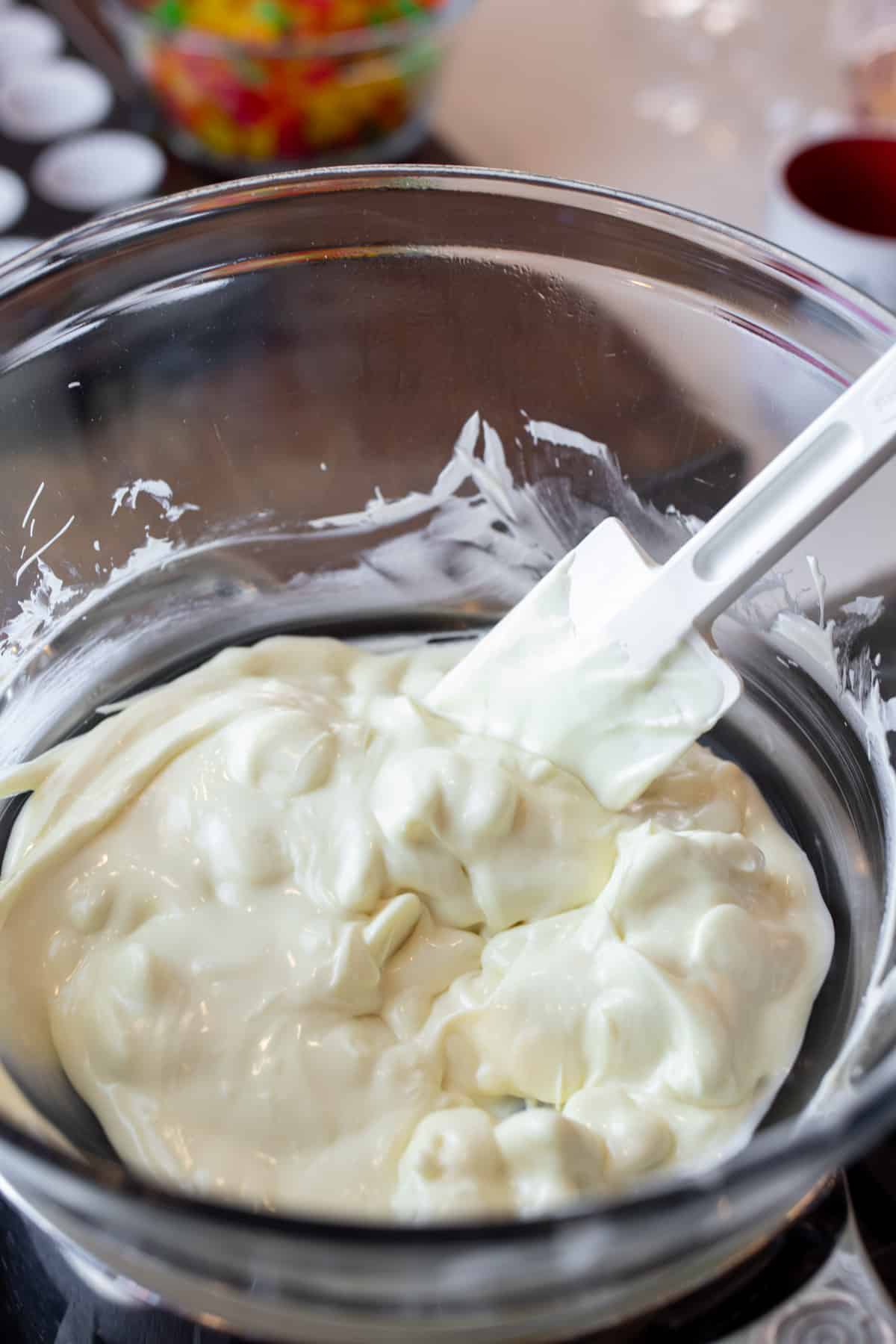 Melted white chocolate in a bowl.