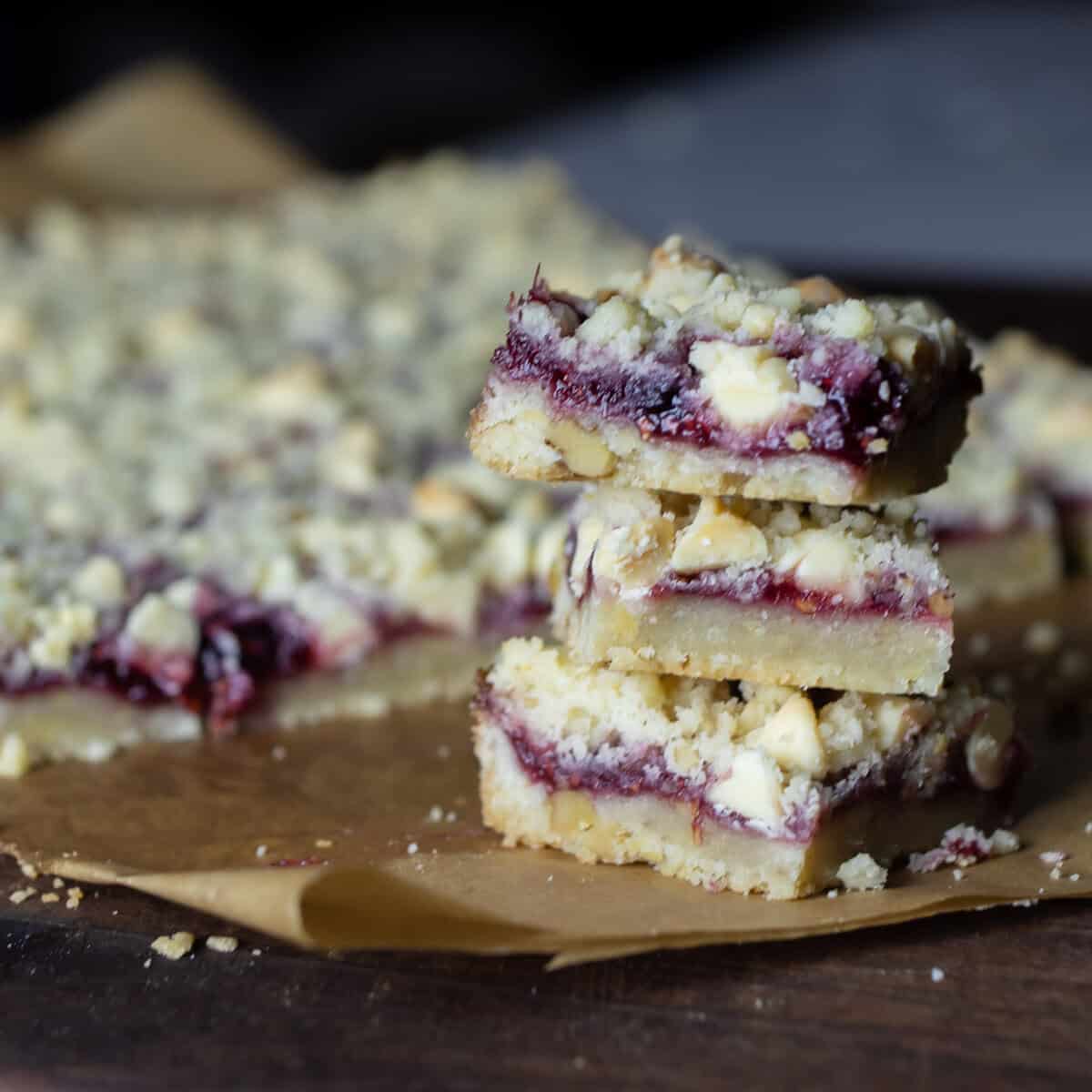 Dessert squares stacked three high.