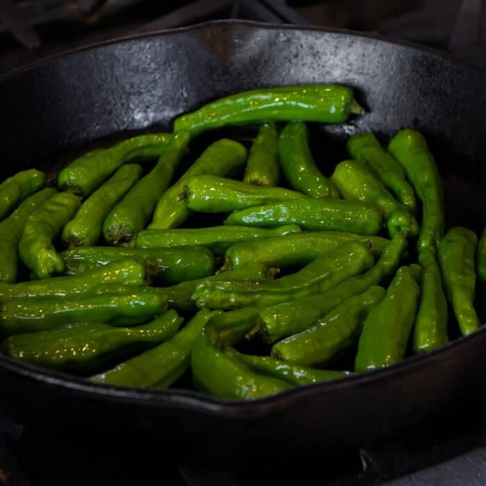 shishito peppers in a skillet